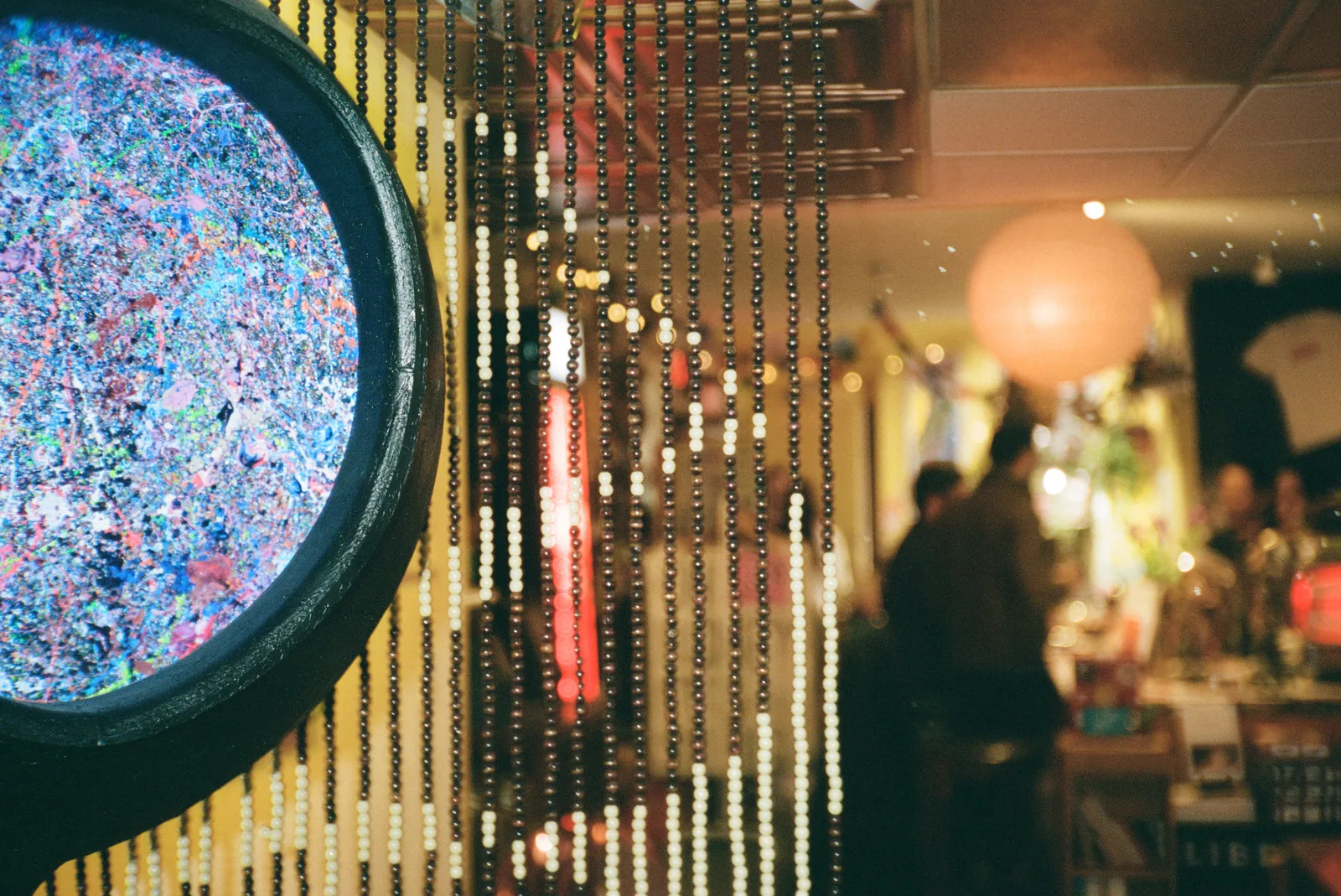 Beaded curtain portal into the café