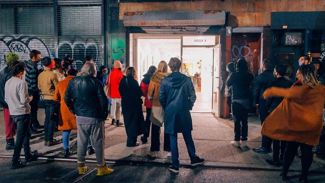 Night crowd gathered outside Sixteen B