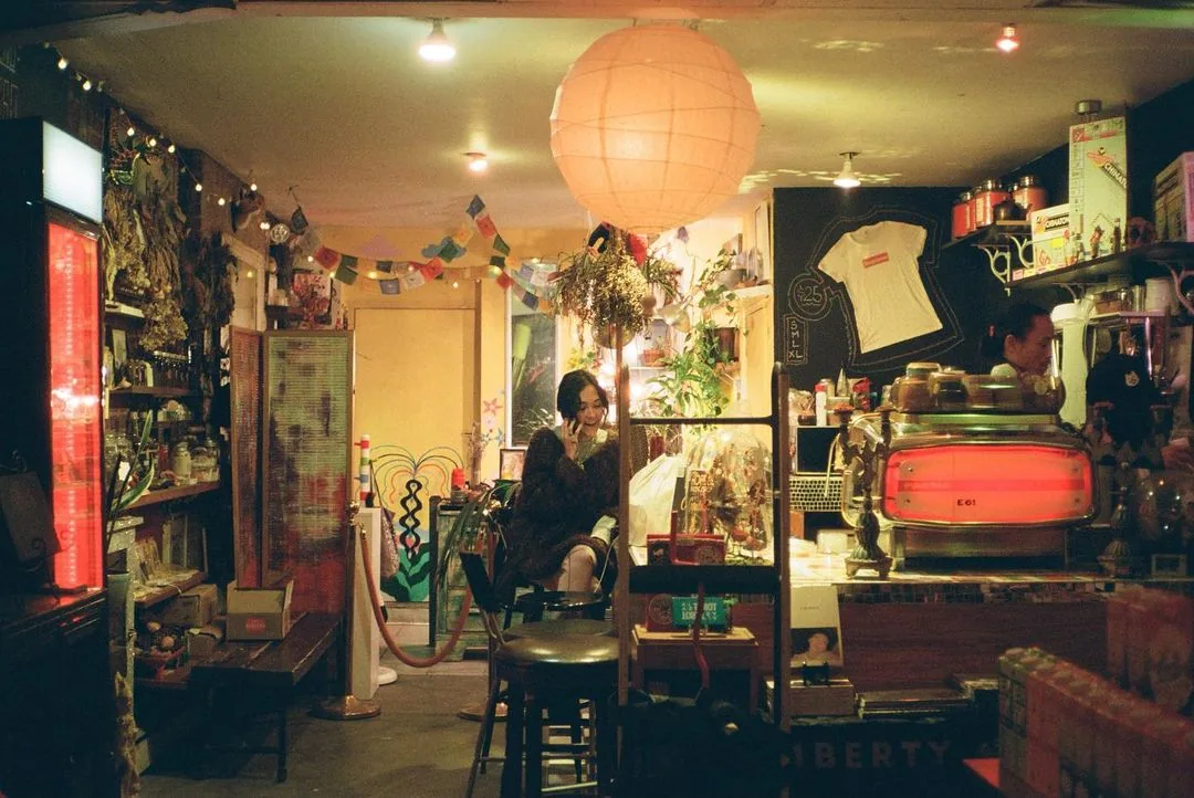 Café interior under the orange lantern