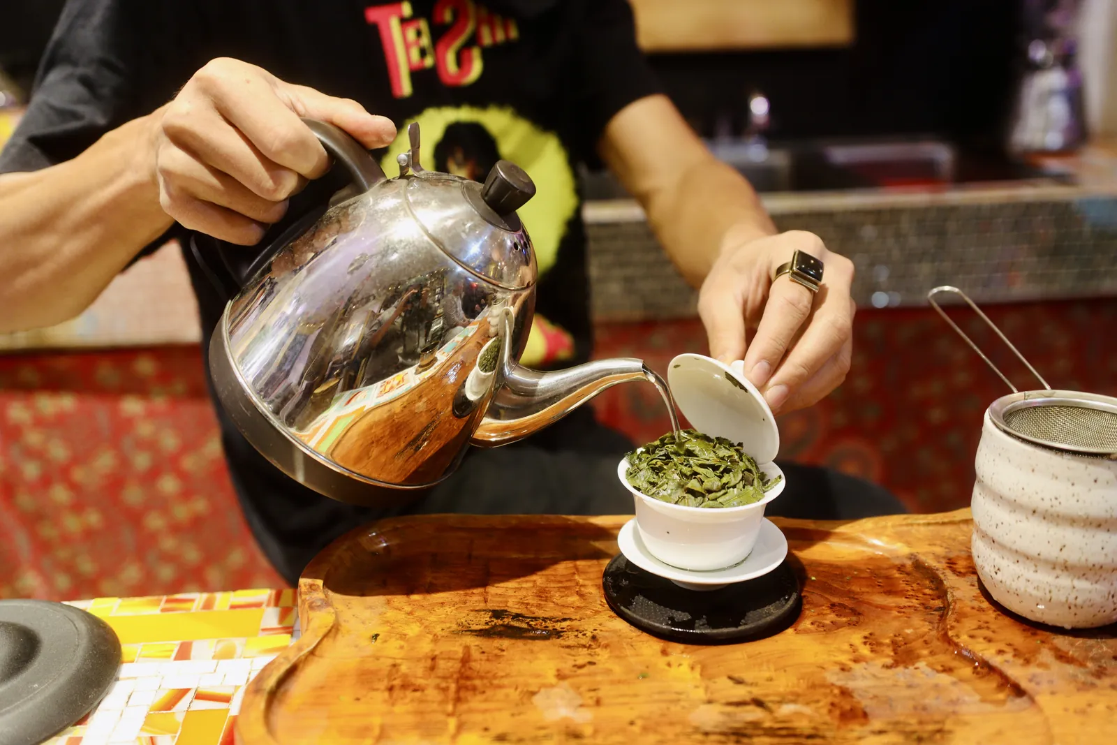 Pouring tea into a gaiwan