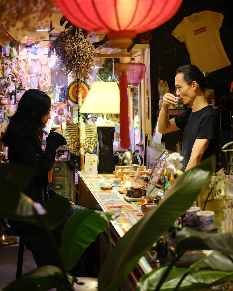 Guests gathered at the Chinatown Soup tea bar behind the gallery